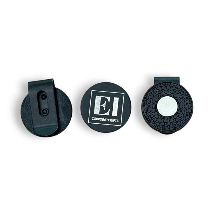 Engraved golf marker hat clip with magnetic design displayed outdoors on a golf course. A personalized promotional gift for golfers, ideal for tournaments, business giveaways, and corporate branding. Durable, lightweight, and custom engraved with your company logo.
