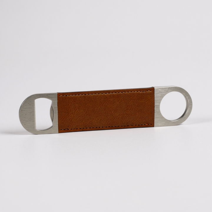Personalized leather golf bottle openers in black, gray, caramel, dark brown, and sand, laser engraved with names or logos, displayed on a white background. Custom golf tournament gifts and corporate promotional items made from durable leather with stainless steel opener, ideal for business branding, giveaways, groomsmen gifts, and golf events.